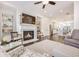 Bright living room showcasing a fireplace, dark wood floors, and open access to the kitchen at 2341 Brissett Ln, Brookhaven, GA 30319
