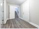 Finished basement featuring modern flooring and staircase access at 3950 Yancey Rd, Douglasville, GA 30135