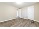 Bedroom with modern flooring, light gray walls and white door at 3950 Yancey Rd, Douglasville, GA 30135