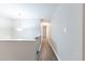 Upstairs hallway with hardwood floors and neutral walls at 3950 Yancey Rd, Douglasville, GA 30135