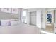 Bright bedroom with walk-in closet and soft pink bedding at 583 Princeton Elm Pl, Lawrenceville, GA 30045
