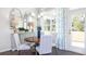 Charming dining area with a round table and access to backyard at 583 Princeton Elm Pl, Lawrenceville, GA 30045