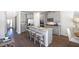 Spacious kitchen with gray cabinets, granite countertops, and island at 583 Princeton Elm Pl, Lawrenceville, GA 30045