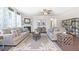 Spacious living room with a fireplace, large windows, and comfortable seating at 583 Princeton Elm Pl, Lawrenceville, GA 30045