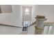 View from upstairs looking down a grand staircase at 583 Princeton Elm Pl, Lawrenceville, GA 30045