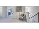 Upstairs hallway with comfortable seating and access to bedrooms at 583 Princeton Elm Pl, Lawrenceville, GA 30045