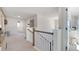 Bright upstairs hallway with access to bedrooms and bathroom at 583 Princeton Elm Pl, Lawrenceville, GA 30045