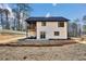 The backyard features a patio, a fenced yard, and a two-story home with a covered deck at 3785 Pilgrim Mill Rd, Cumming, GA 30041