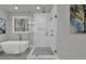 Modern bathroom features a glass shower, soaker tub and a window providing natural light at 3785 Pilgrim Mill Rd, Cumming, GA 30041