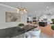 Bright dining area with modern lighting and an open layout flowing into the kitchen and living room at 3785 Pilgrim Mill Rd, Cumming, GA 30041