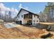 A modern two-story home features a two-car garage and an open patio at 3785 Pilgrim Mill Rd, Cumming, GA 30041