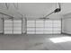 Clean, well-lit garage with plenty of space for vehicles and storage, adding functionality to the home at 3785 Pilgrim Mill Rd, Cumming, GA 30041