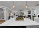 Large kitchen island with white countertops and stainless steel appliances at 3785 Pilgrim Mill Rd, Cumming, GA 30041