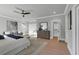 Sunlit bedroom showcasing an ensuite seating area and a glimpse of a walk-in closet at 3785 Pilgrim Mill Rd, Cumming, GA 30041