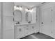 Elegant bathroom, featuring double vanity and dark tile floors at 42 Puckett Se Rd, Emerson, GA 30137