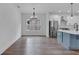 Bright dining room with hardwood floors and chandelier, adjacent to kitchen at 42 Puckett Se Rd, Emerson, GA 30137