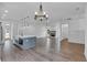 Open concept dining room with hardwood floors and chandelier, overlooking living room at 42 Puckett Se Rd, Emerson, GA 30137