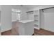 Bright walk-in closet with island and hanging space at 42 Puckett Se Rd, Emerson, GA 30137