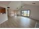 Bright living room with vaulted ceiling, hardwood floors, and kitchen views at 941 Garden Oak Ct, Lawrenceville, GA 30043