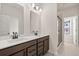 Double vanity bathroom with a large shower and modern fixtures at 314 Cornett Way, Lawrenceville, GA 30046