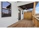 Covered deck with wood flooring and ceiling fan at 314 Cornett Way, Lawrenceville, GA 30046