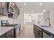 Modern kitchen with stainless steel appliances and hardwood floors at 314 Cornett Way, Lawrenceville, GA 30046