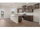 Modern kitchen with island and stainless steel appliances at 314 Cornett Way, Lawrenceville, GA 30046