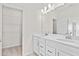 Bathroom with double vanity and linen closet at 309 Sammon Way, Lawrenceville, GA 30046