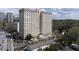Aerial view of a high-rise building showcasing its architecture and surrounding greenery at 2479 Peachtree Ne Rd # 105, Atlanta, GA 30305