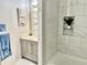 Modern bathroom featuring a vanity, tiled shower with a decorative storage niche, and blue towels at 2479 Peachtree Ne Rd # 105, Atlanta, GA 30305