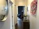 Hallway view looking into another living space with hardwood floors and neutral paint at 2479 Peachtree Ne Rd # 105, Atlanta, GA 30305