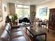 Living room with hard wood floors, high ceilings, and lots of natural light at 2479 Peachtree Ne Rd # 105, Atlanta, GA 30305