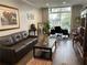 Living room with hard wood floors, high ceilings, and lots of natural light at 2479 Peachtree Ne Rd # 105, Atlanta, GA 30305