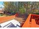 Landscaped backyard with wooden fence and patio at 1079 Bar Harbor Pl, Lawrenceville, GA 30044