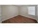 Simple bedroom with hardwood floors and a window at 1079 Bar Harbor Pl, Lawrenceville, GA 30044