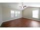 Spacious bedroom with hardwood floors and multiple windows at 1079 Bar Harbor Pl, Lawrenceville, GA 30044