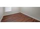 Small bedroom with hardwood floors and a window at 1079 Bar Harbor Pl, Lawrenceville, GA 30044