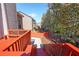 Red deck with stairs leading to backyard, great for entertaining at 1079 Bar Harbor Pl, Lawrenceville, GA 30044