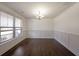 Bright dining room with hardwood floors and wainscoting at 1079 Bar Harbor Pl, Lawrenceville, GA 30044