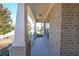 Inviting front porch with brick columns and white railing at 1079 Bar Harbor Pl, Lawrenceville, GA 30044