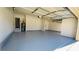 Spacious two-car garage with epoxy floor and storage at 1079 Bar Harbor Pl, Lawrenceville, GA 30044