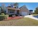 Brick house with a three-car garage and landscaped yard at 1079 Bar Harbor Pl, Lawrenceville, GA 30044