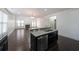 Open kitchen with island and view into Gathering room at 1079 Bar Harbor Pl, Lawrenceville, GA 30044