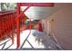 Covered patio with red stairs leading to backyard at 1079 Bar Harbor Pl, Lawrenceville, GA 30044