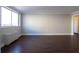 Bright living room with hardwood floors and large window at 215 Piedmont Ne Ave # 502, Atlanta, GA 30308