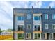 Modern townhome exterior with large windows, gray siding, and black accents at 1641 Mcnaught Dr # 35, Atlanta, GA 30317