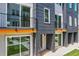 A close-up view of a modern townhome exterior with balconies and large sliding glass doors at 1641 Mcnaught Dr # 35, Atlanta, GA 30317