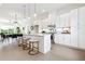 Bright kitchen with white cabinetry, quartz countertops, stainless steel appliances, and an island at 1641 Mcnaught Dr # 35, Atlanta, GA 30317