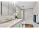 Clean bathroom with white subway tiles, marble vanity, and tub at 2870 Pharr Court South Nw # 2002, Atlanta, GA 30305