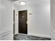 Modern hallway with dark brown door and carpet at 2870 Pharr Court South Nw # 2002, Atlanta, GA 30305